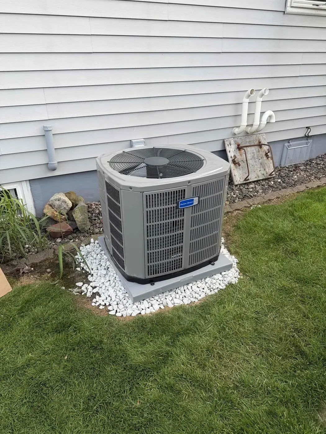 After — new American Standard condenser on a new pad with clear airflow