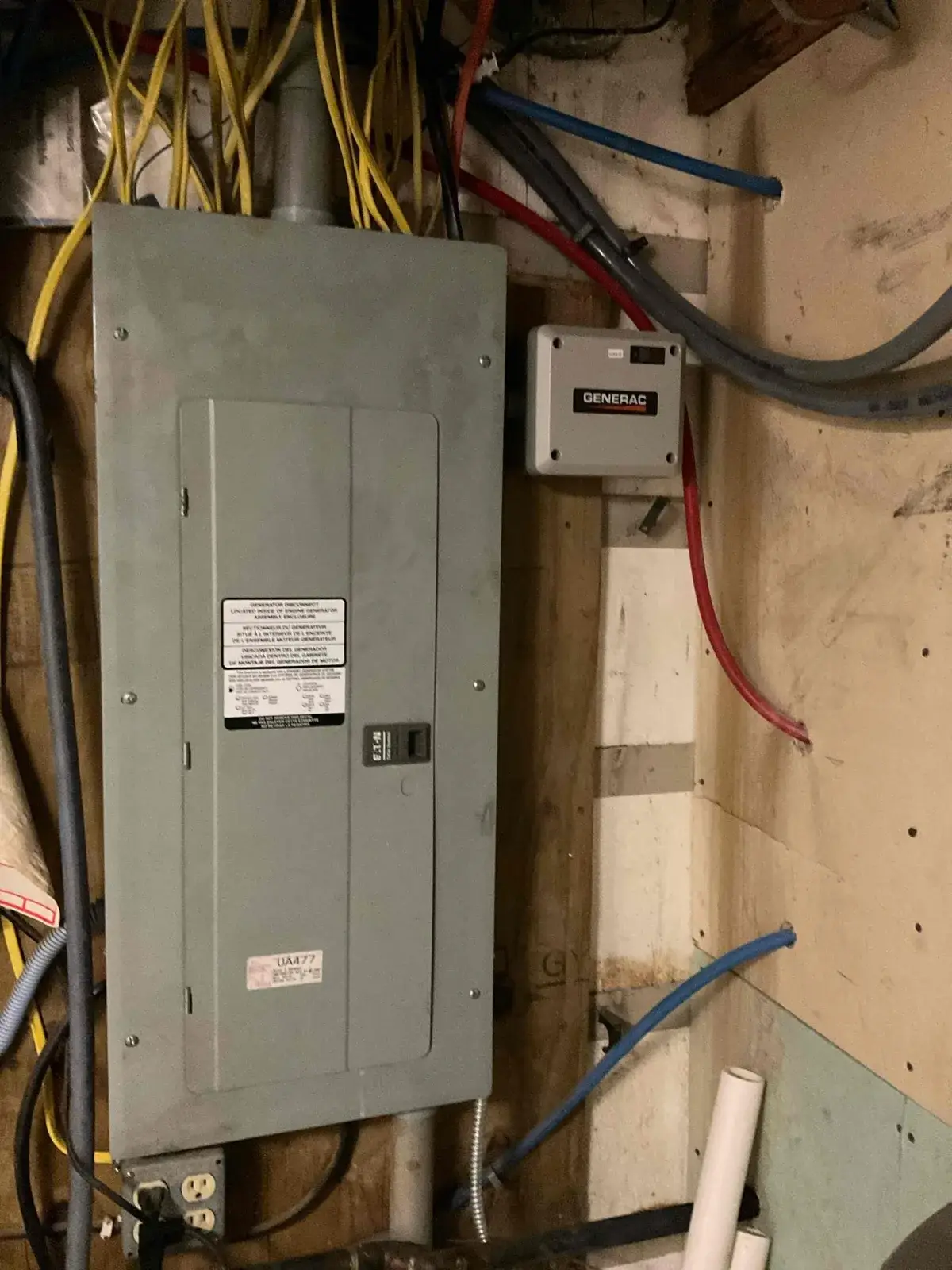 After — transfer switch wired in beside the existing panel
