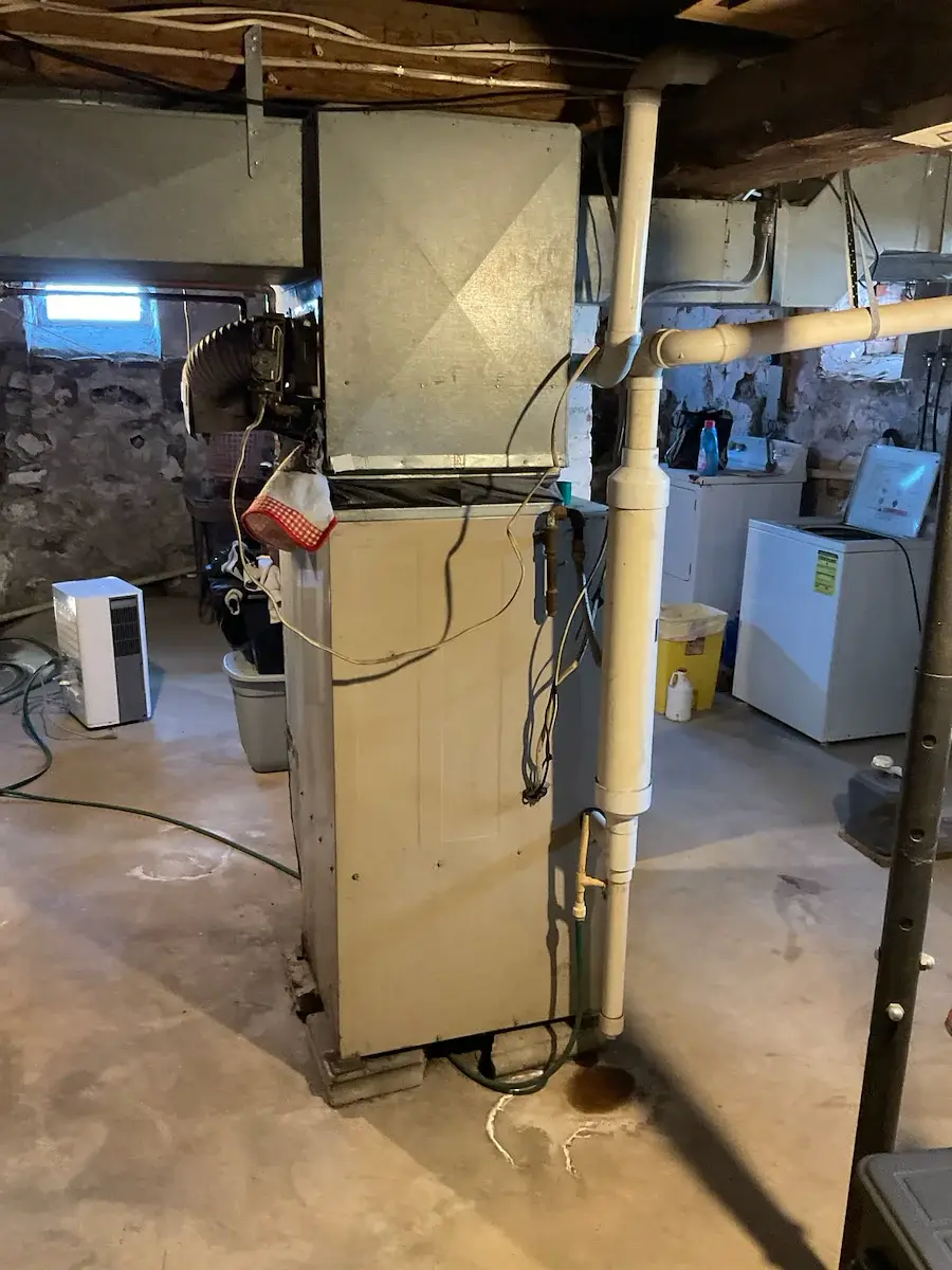 Before — aging furnace and venting in a Colby basement - Colby, WI