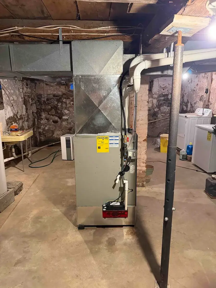 After — the replacement furnace running, venting and wiring finished out