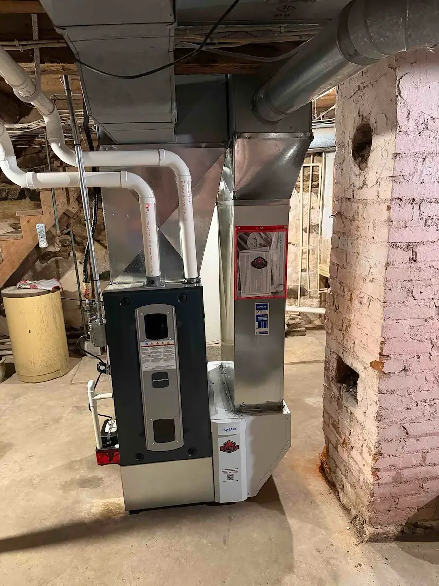 After — new high-efficiency furnace in place with rebuilt plenum - Colby, WI