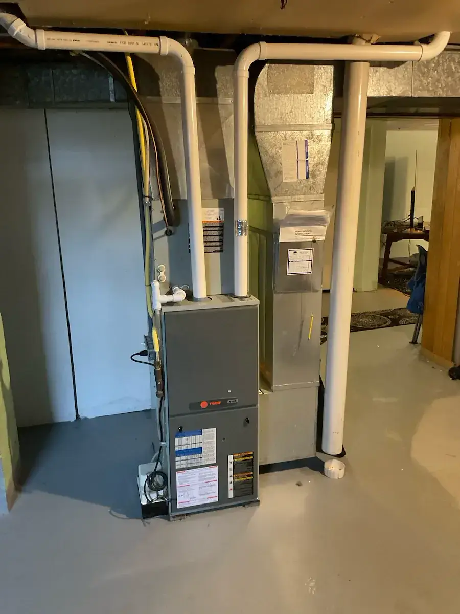 Before — a Trane furnace with a plugged heat exchanger, due for replacement