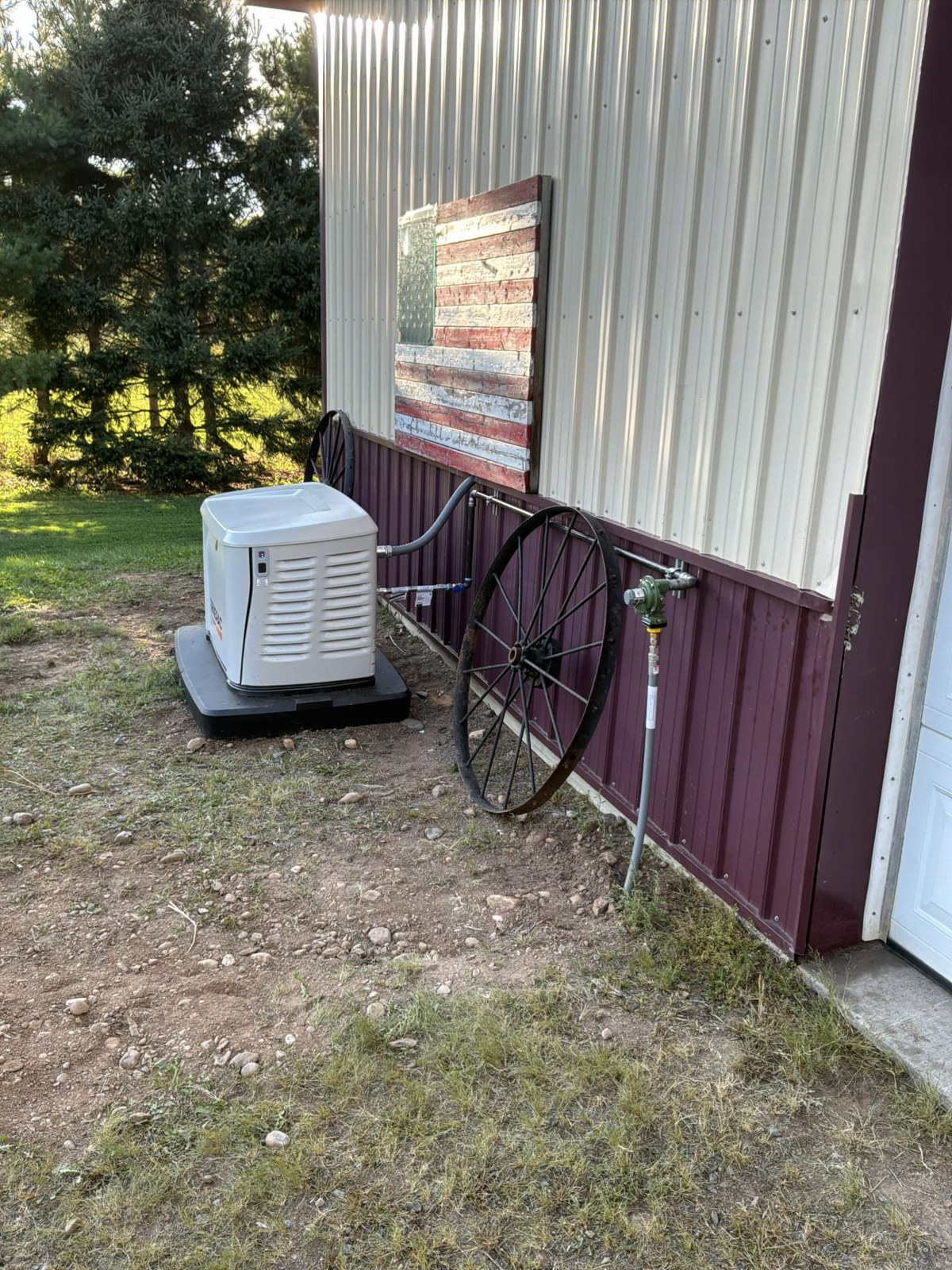 Generac 18 kW standby generator installed by Red Barn Service beside a home, with gas line and regulator