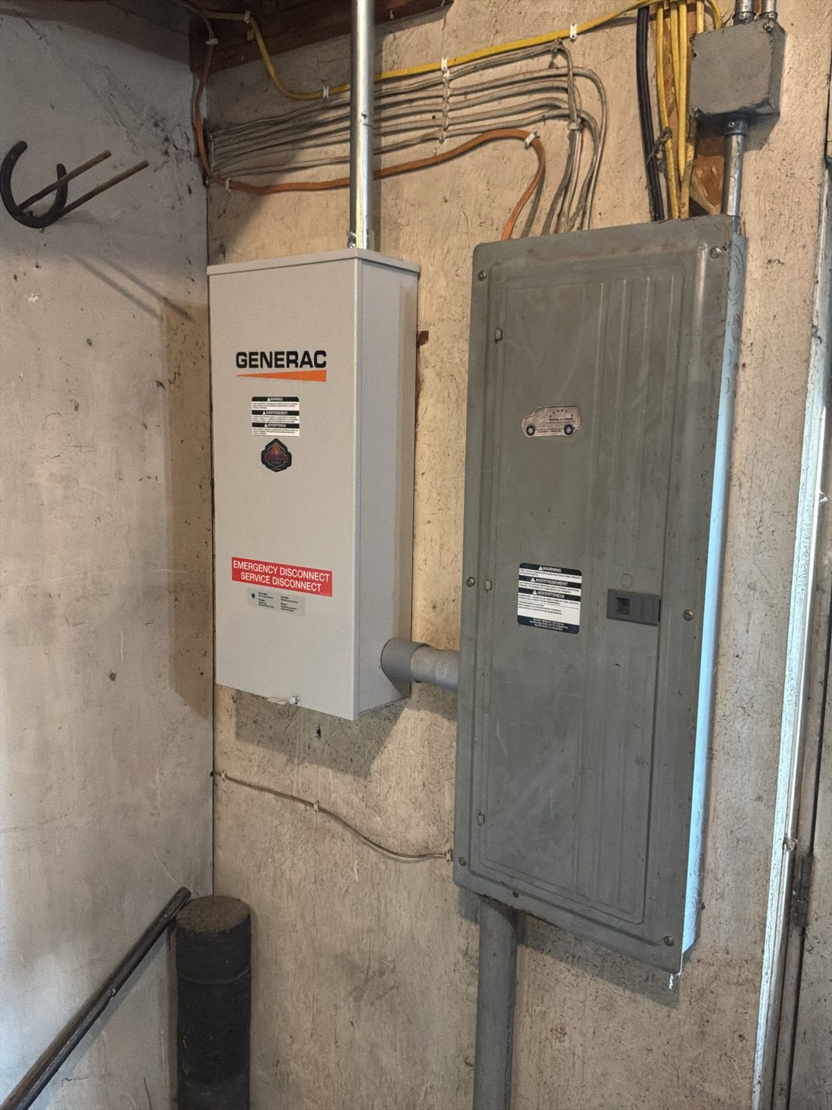 Generac automatic transfer switch mounted next to the electrical panel