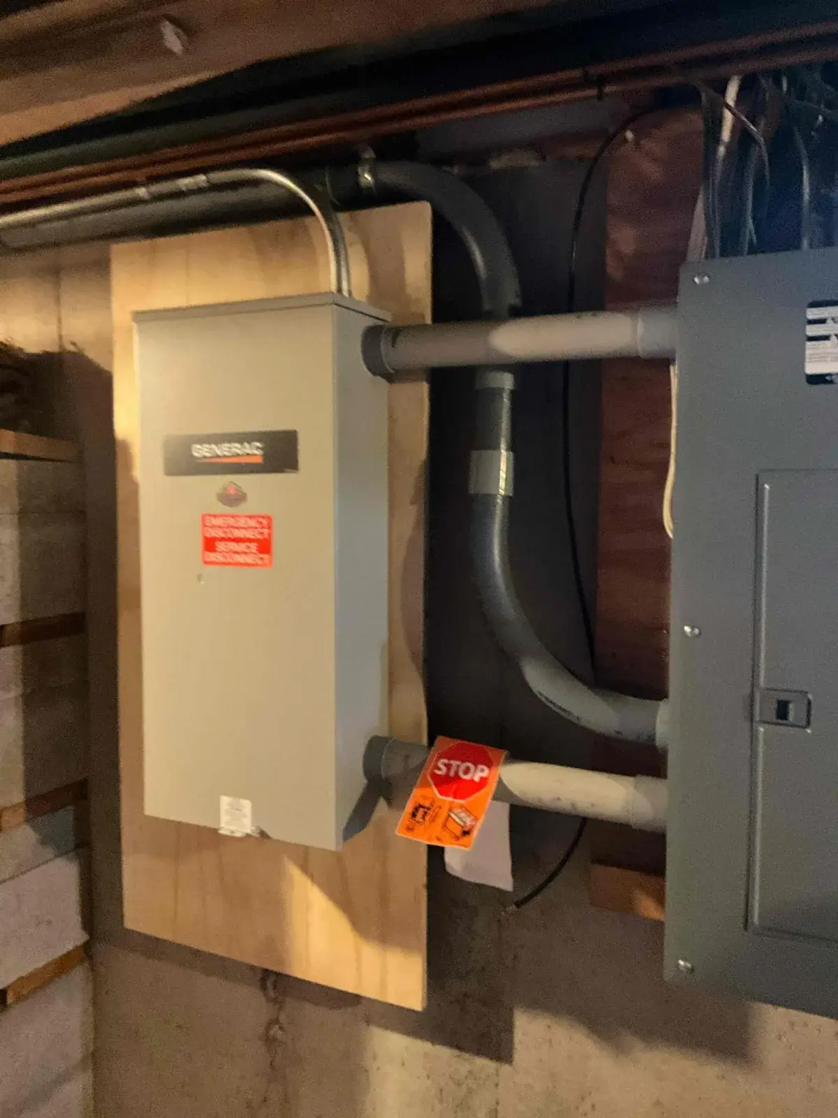 After — automatic transfer switch mounted and wired next to the main panel