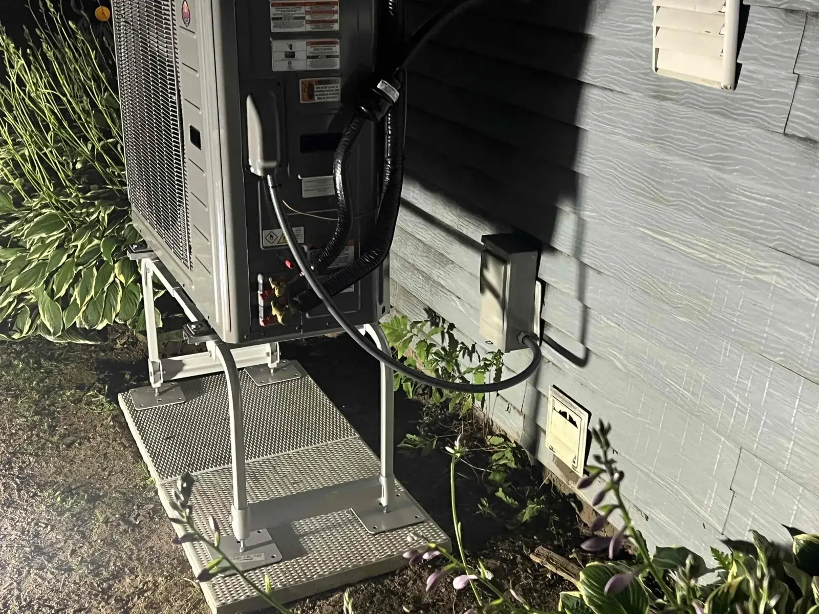 After — line set, whip and disconnect run clean behind the new unit