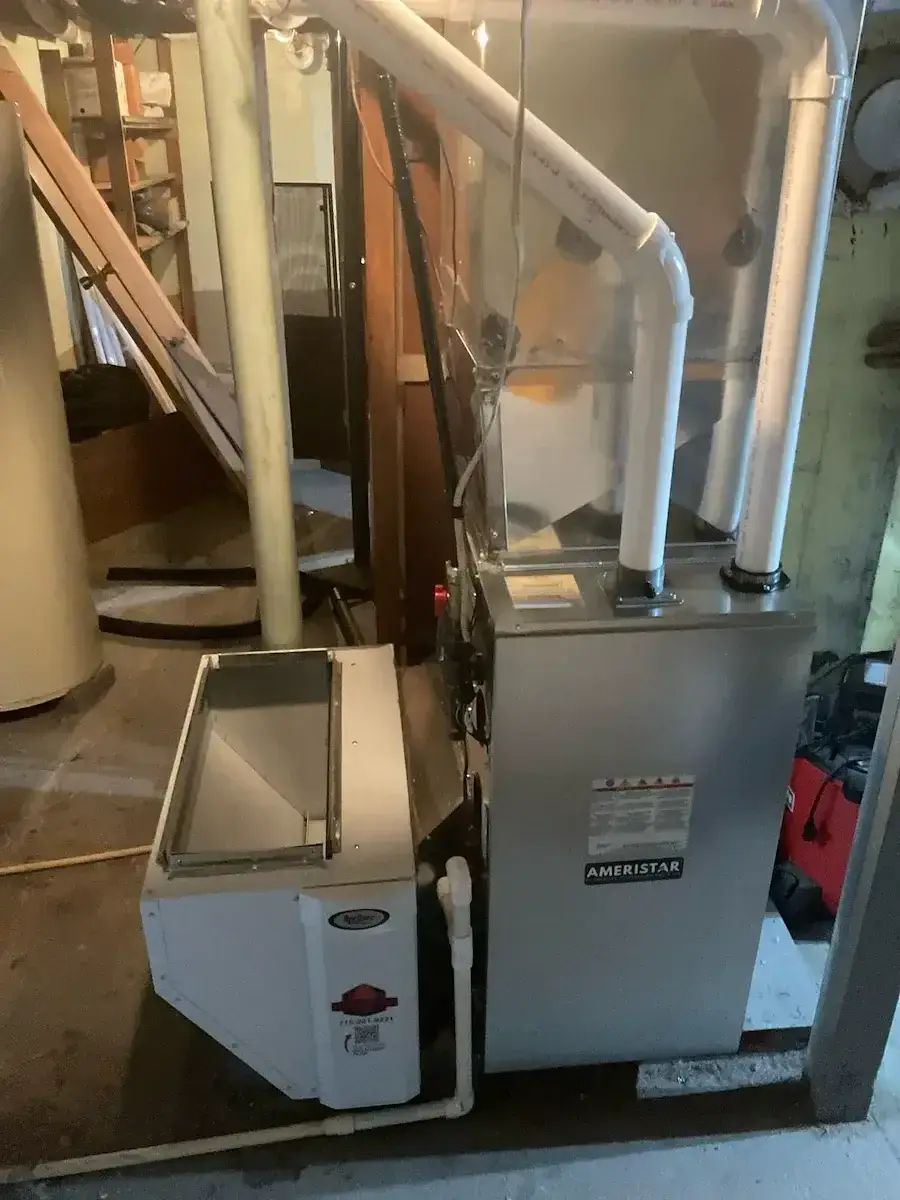 After — new Ameristar furnace with a media filter cabinet and new PVC venting
