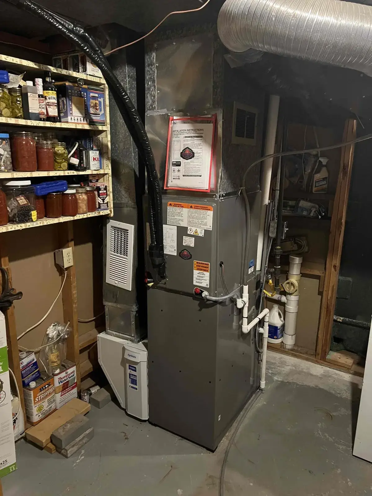 After — the finished furnace and dehumidifier in a working basement