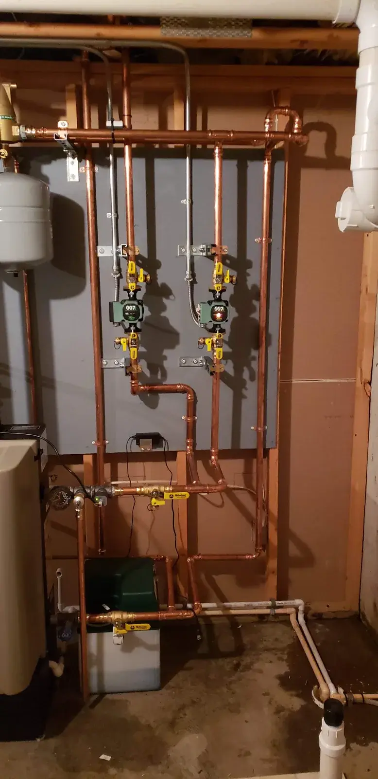 Two-zone copper near-boiler piping with expansion tank and circulators