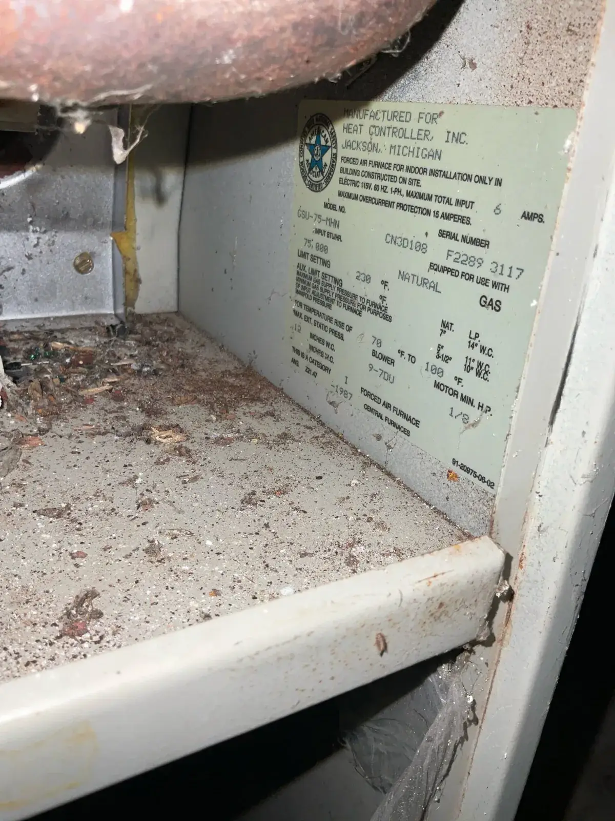 Before — 1987 data plate on the furnace we took out