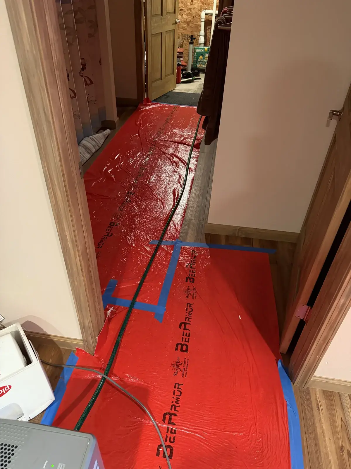 During install — floor and wall protection down before we move any equipment