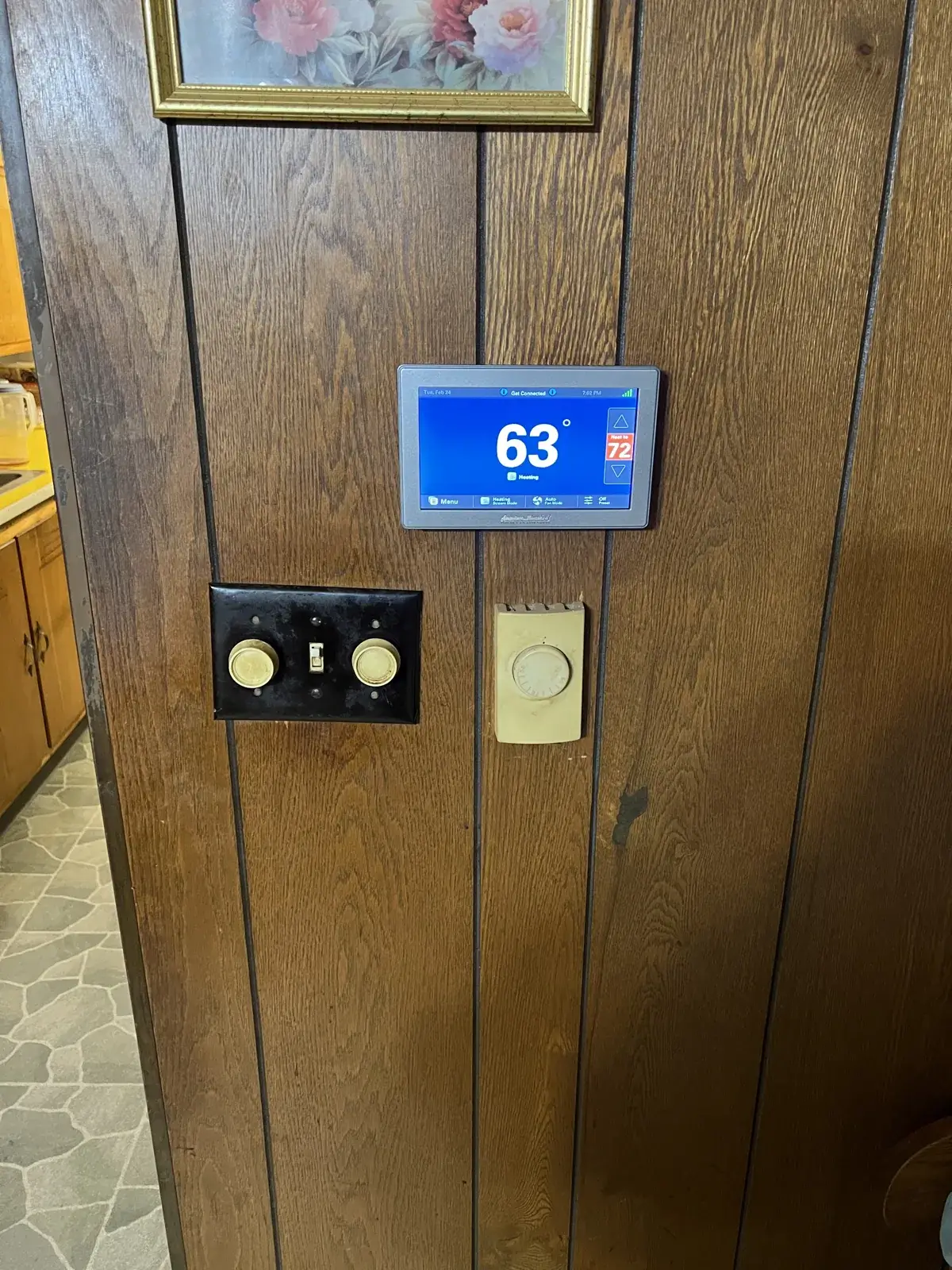 After — new American Standard smart thermostat replacing the old dial thermostat