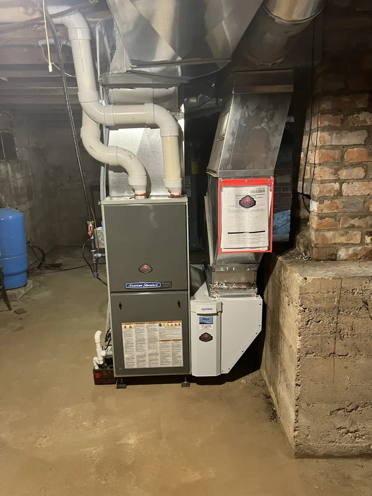 After — new American Standard furnace with AprilAire media filter cabinet and new venting in the basement