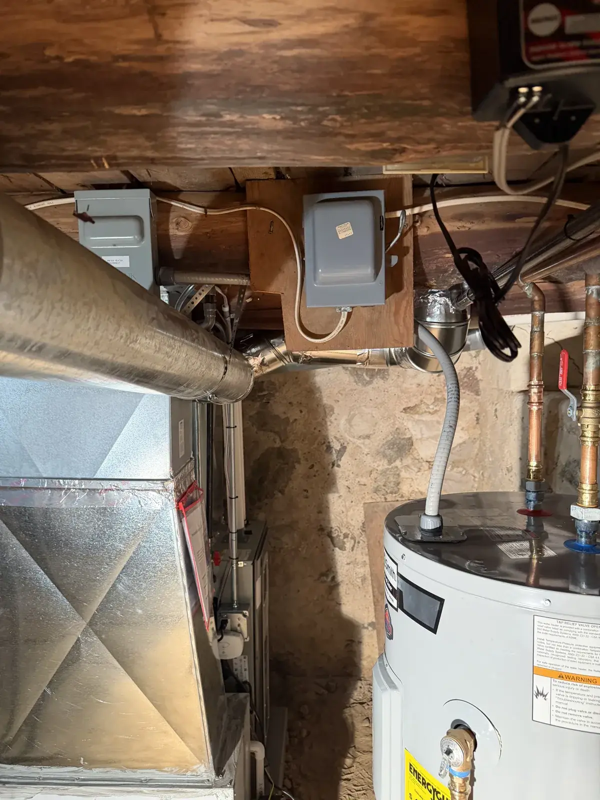After — new furnace, ductwork and disconnects finished in the mechanical room