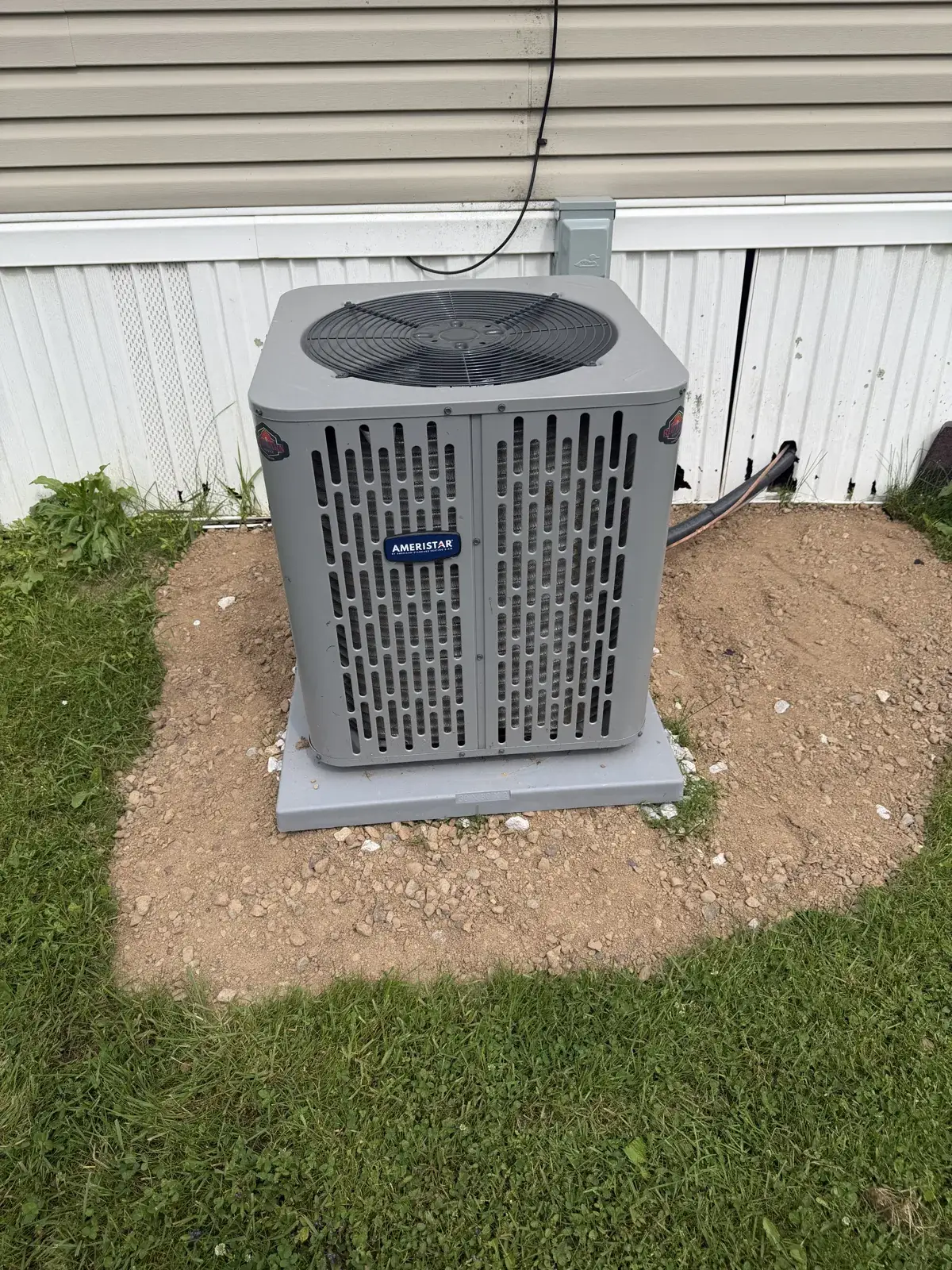 After — new Ameristar condenser set on a level pad