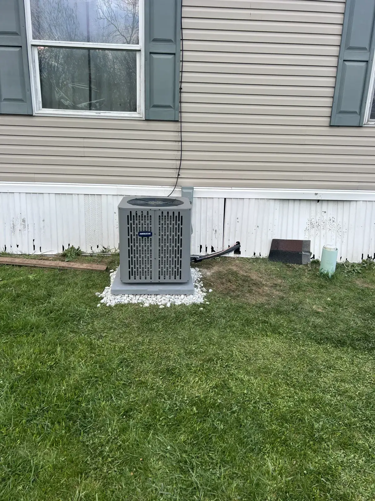 After — new outdoor unit and lineset run cleanly along the home
