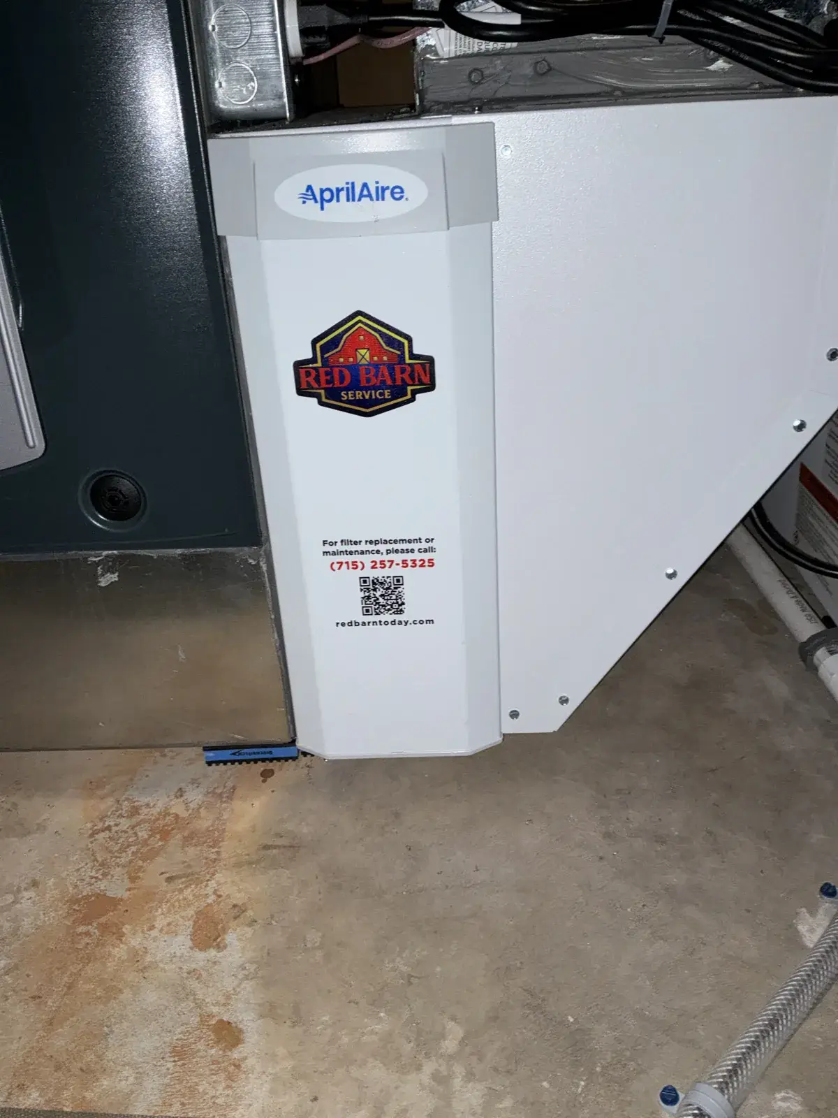 After — AprilAire media filter cabinet installed and labeled with our number for easy filter service