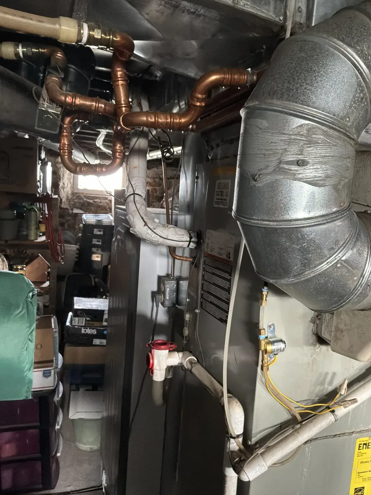 New furnace with rebuilt gas piping and venting in a tight mechanical room