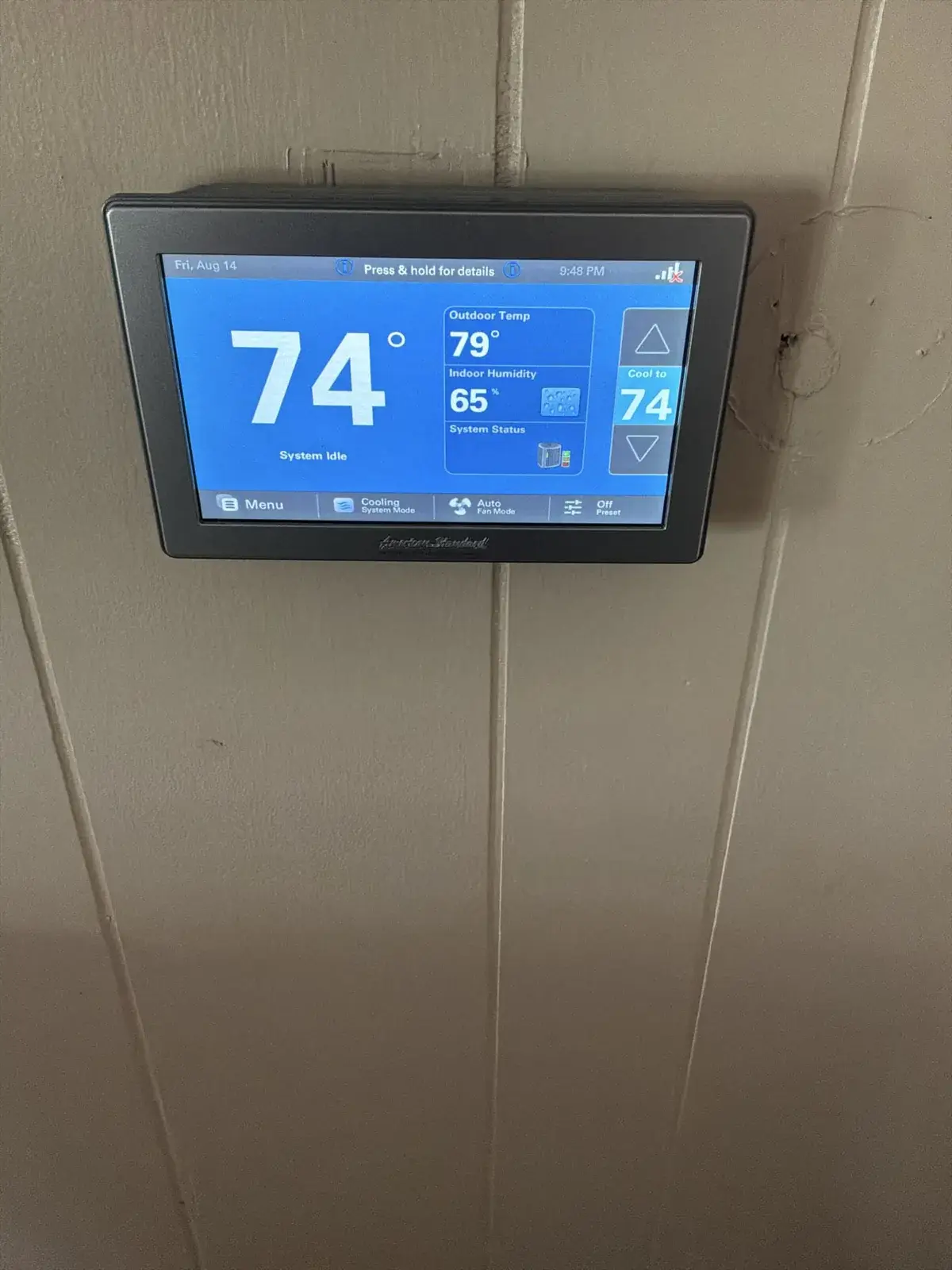 New American Standard smart thermostat — humidity and outdoor temp at a glance