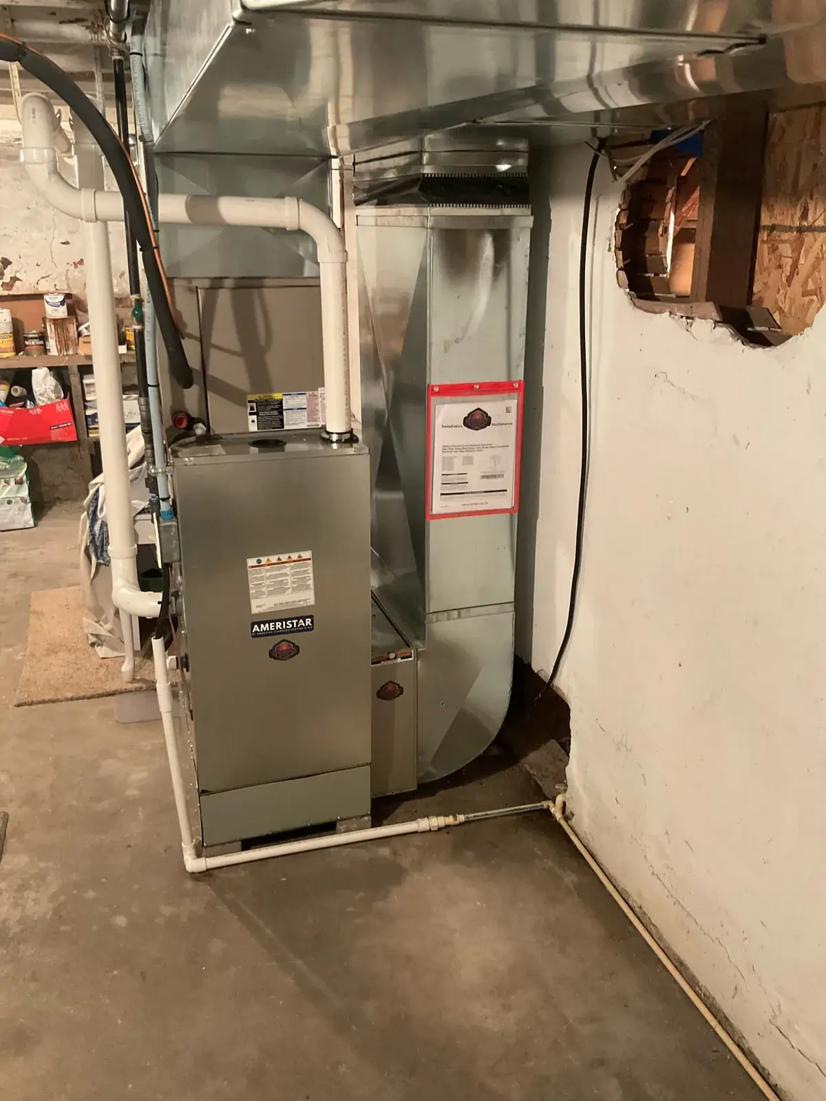 After — new Ameristar high-efficiency furnace with new sheet metal and PVC venting