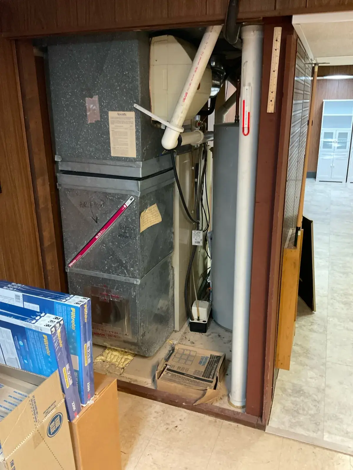 Before — the original closet furnace we replaced - Wausau, WI