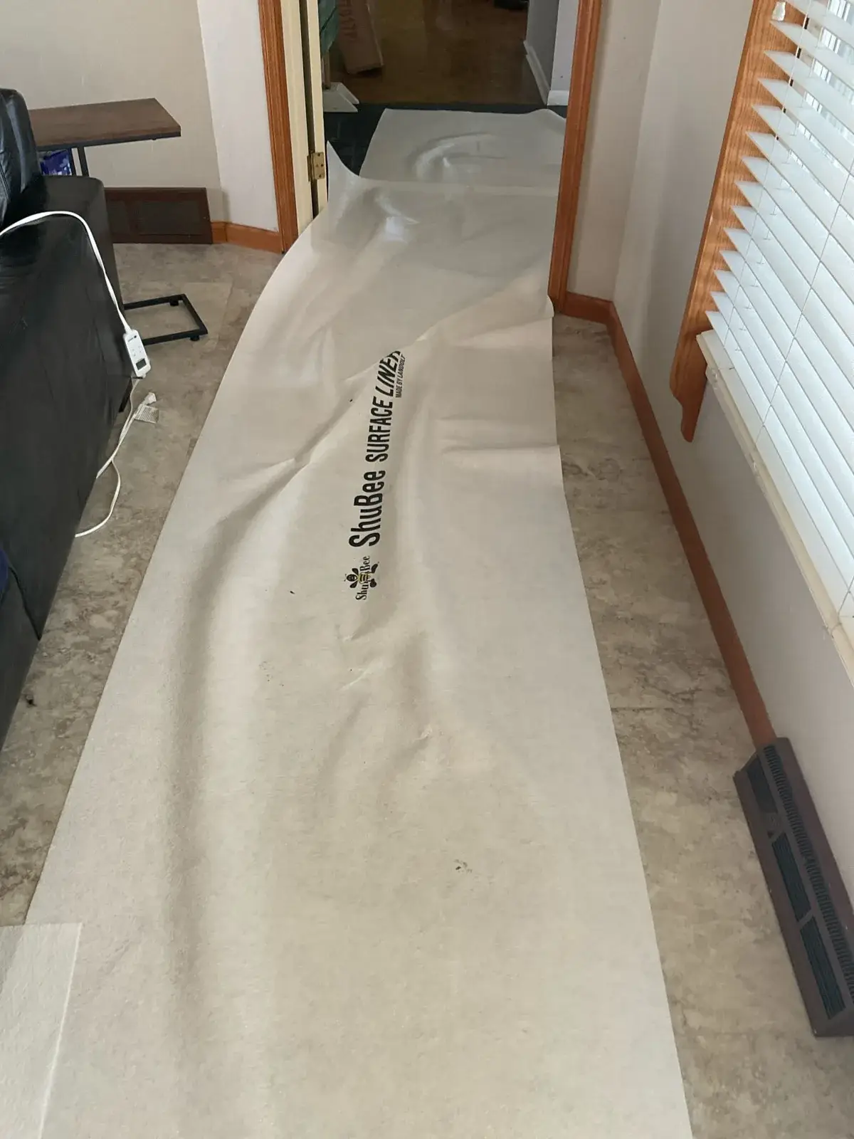 During install — floor protection down before we carry anything in - Wausau, WI