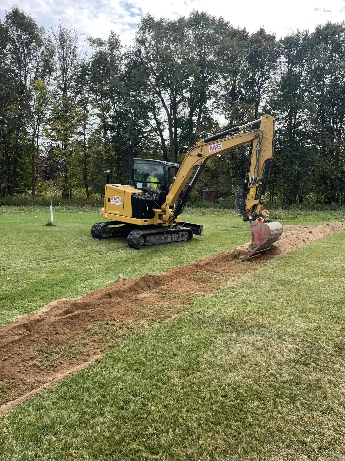 Trenching the service run to a new shop building