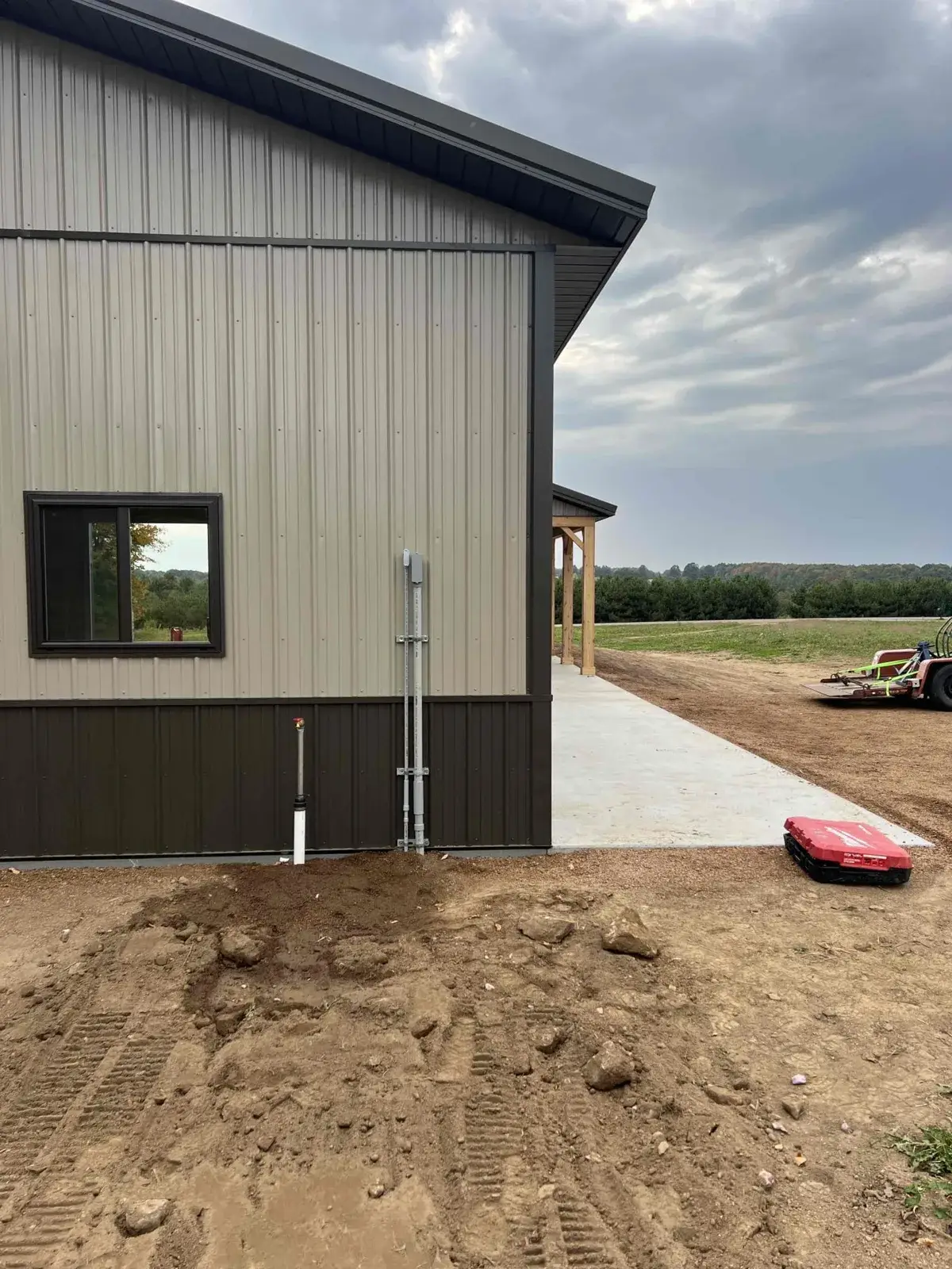 New service riser and conduit run up the side of a new pole building