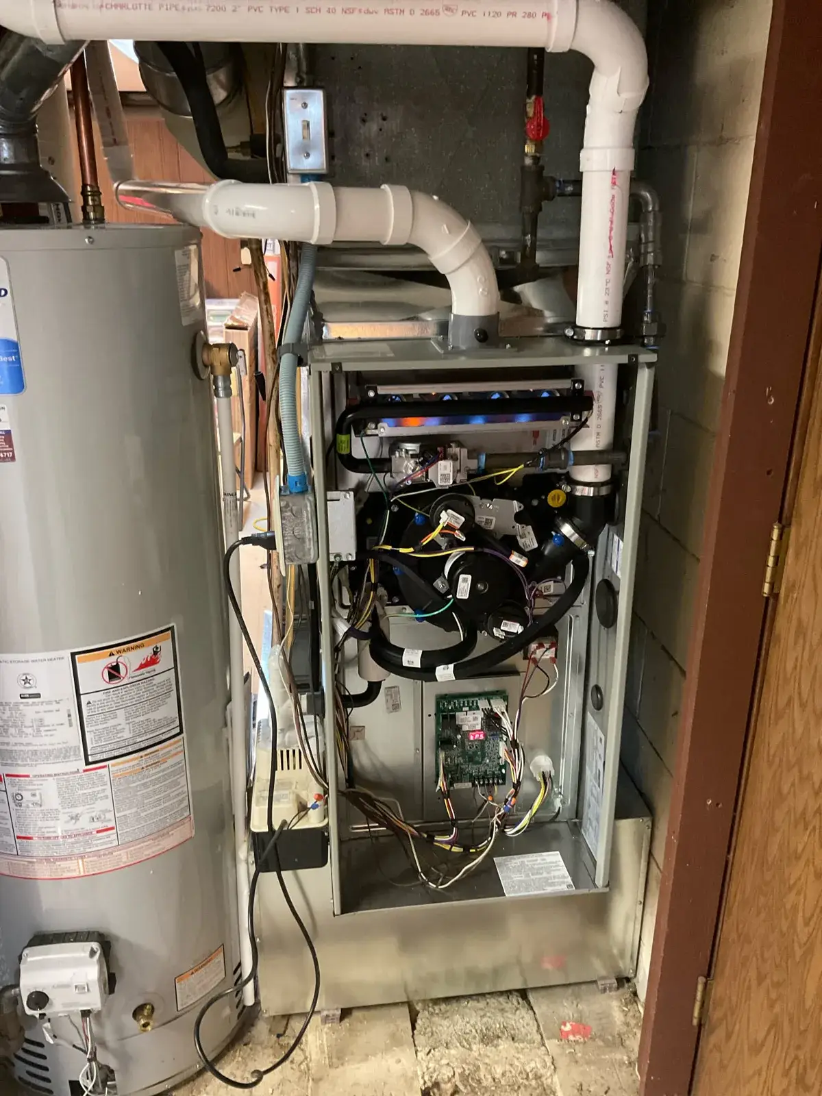 During install — control board and wiring checked with the doors off